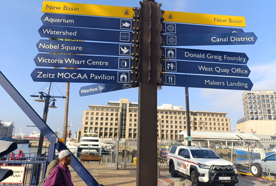 Traveyola Signpost with directional signs at the V & A Waterfront in Cape Town, South Africa
